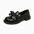 Mocassins vernis noirs à nœud